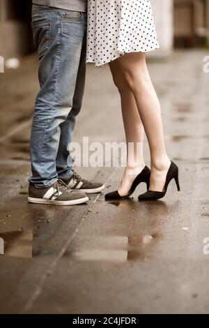 Close up of legs of kissing couple Stock Photo - Alamy