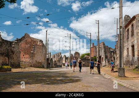 Main street of Oradour-sur-Glane with ruins of the village where the inhabitants were murdered by the Nazis on 10th of June 1944, Haute-Vienne (87), N Stock Photo