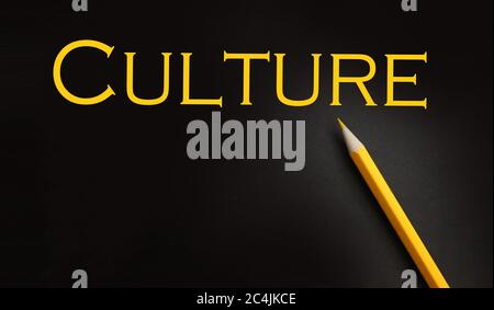 Culture word typed in yellow on black paper , social concept background Stock Photo