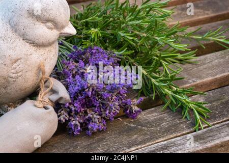 Fresh aromatic herb bundles and scented sachet decorated outside. Stock Photo