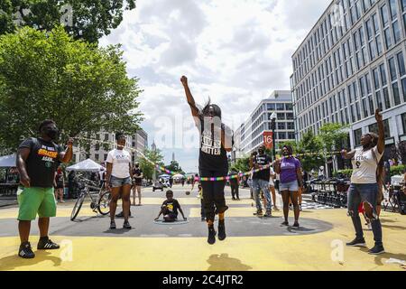 Washington, United States. 27th June, 2020. A woman jumps rope during a The Chocolate City Experience & Black Lives Matter DC Collab gathering at Black Lives Matter Plaza on Saturday, June 27, 2020 in Washington, DC. Demonstrations and protests have taken place daily since the death of George Floyd on May 25, 2020 in Minneapolis, Minnesota. Photo by Leigh Vogel/UPI Credit: UPI/Alamy Live News Stock Photo