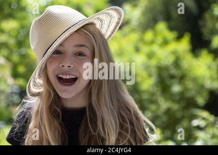 Girl (11) with sun hat, Kiel, Schleswig-Holstein, Germany Stock Photo