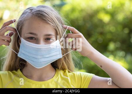 Girl (11) with mouth-nose protection, Kiel, Schleswig-Holstein, Germany Stock Photo
