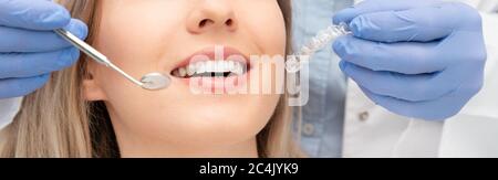 Woman having teeth examined at dentists. Teeth whitening, dental care concept Stock Photo