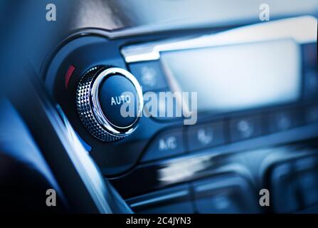 Air conditioner control panel, car cooling system. Close up photo of front panel with AC knob Stock Photo