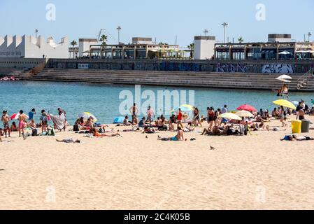 BARCELONA - JUNE 26, 2020: Platja de la Nova Icària beach with people in summer after COVID 19 on June 26, 2020 in Barcelona, Spain. Stock Photo