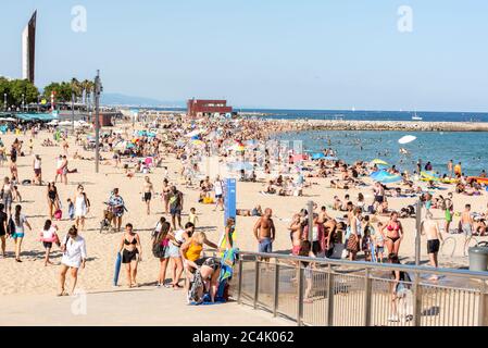 BARCELONA - JUNE 26, 2020: Platja de la Nova Icària beach with people in summer after COVID 19 on June 26, 2020 in Barcelona, Spain. Stock Photo