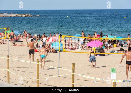 BARCELONA - JUNE 26, 2020: Platja de la Nova Icària beach with people in summer after COVID 19 on June 26, 2020 in Barcelona, Spain. Stock Photo