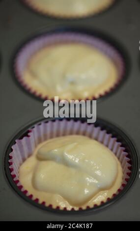 Cupcake batter in cupcake cups Stock Photo