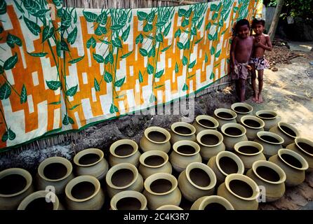 Colourful earthenware like pots, jars and vases enhance the beauty of city households. Besides, it is a source of livelihood to many potters. Banglade Stock Photo