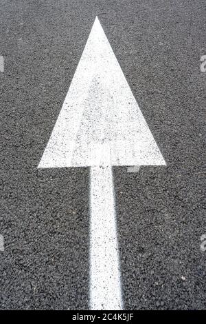 Street signs on the road. Arrow pointing forward, direction indicator. Stock Photo