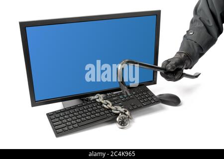 computer security - a sinister looking hacker using a crowbar to access a locked computer Stock Photo