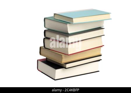 an uneven stack of old hard cover bound books isolated on white Stock Photo