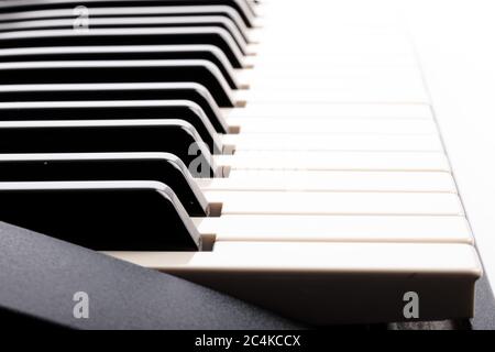 closeup looking along an electronic piano keyboard Stock Photo