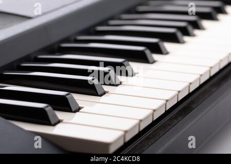 closeup of the black and white keys of an electronic keyboard Stock Photo