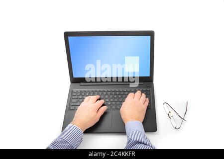 a man's hand on a notebook computer keyboard isolated on white Stock Photo