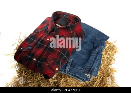 farm fashion, denim blue jeans and a red paid shirt isolated on white Stock Photo