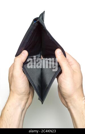 A man holds an empty black leather wallet on a white background Stock Photo