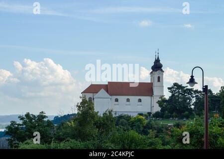 The century-old building of the Tihany Abbey photographed from the side in a colorful summer environment Stock Photo