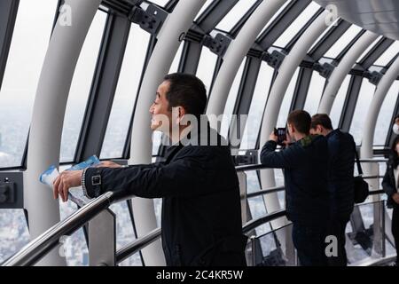 People at the Tokyo Skytree Observation Deck, also known as 'Tembo Gallery' starting at the 445th floor. Tokyo, Japan. Stock Photo