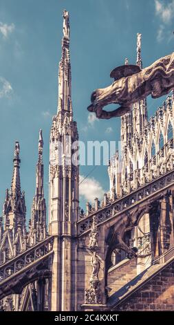 Milan Cathedral roof close-up, Italy, Europe. Milan Cathedral or Duomo di Milano is top landmark of Milan city. Luxury decorations detail of Milan arc Stock Photo