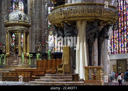 Milan, Italy - May 16, 2017: Luxury interior of the old Milan Cathedral (Duomo di Milano). Famous Gothic Milan Cathedral is a top tourist attraction o Stock Photo