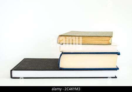 a stack of 4 books viewed from above isolated on white Stock Photo