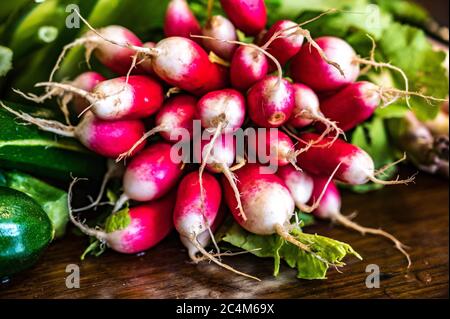 Closeup shot of a bundle of radish and greens on a table Stock Photo