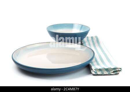 a blue dinner plate with a blue soup bowl isolated on white Stock Photo