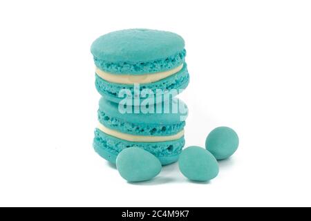 blue macaroon cookies and mini Easter eggs on a white background Stock Photo