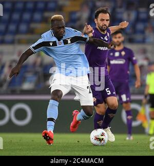 Rome. 28th June, 2020. Fiorentina's Milan Badelj (R) vies with Lazio's Felipe Caicedo during a Serie A football match between Lazio and Fiorentina in Rome, Italy, June 27, 2020. Credit: Xinhua/Alamy Live News Stock Photo