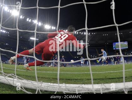 Rome. 28th June, 2020. Lazio's Ciro Immobile (R) scores during a Serie A football match between Lazio and Fiorentina in Rome, Italy, June 27, 2020. Credit: Xinhua/Alamy Live News Stock Photo