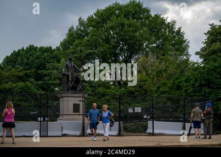 Washington, District of Columbia, USA. 27th June, 2020. People pass by the Emancipation Memorial, depicting a freed slave kneeling at the feet of President Abraham Lincoln, on Saturday, June 27, 2020, in Washington, District of Columbia. Credit: Sait Serkan Gurbuz/ZUMA Wire/Alamy Live News Stock Photo