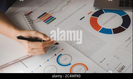 Businessman analyzing investment charts with laptop. Business concept. Stock Photo