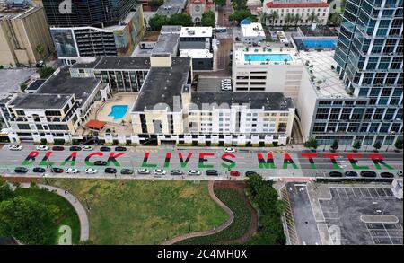 Orlando, United States. 28th June, 2020. (EDITORS NOTE: image taken with a drone)A 400-foot-long 'Black Lives Matter' street mural is seen across from Lake Eola Park in downtown Orlando. Similar paintings have appeared in dozens of U.S. cities in the wake of protests in response to the killing of 46-year-old George Floyd in Minneapolis. Credit: SOPA Images Limited/Alamy Live News Stock Photo