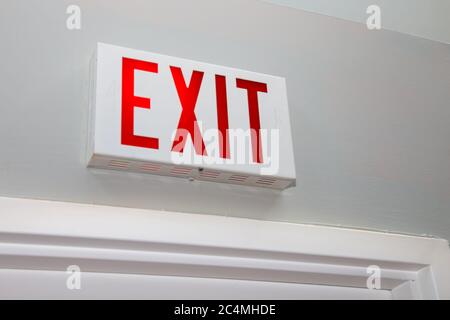 Exit Sign Above an Office Door Stock Photo
