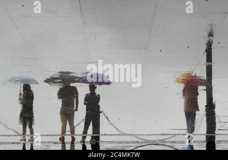 Hangzhou, Hangzhou, China. 28th June, 2020. ZhejingÃ¯Â¼Å'CHINA-Visitors' shadows are reflected on the flagstones of a lakeside park in Hangzhou, East China's Zhejiang province, June 25, 2020. Credit: SIPA Asia/ZUMA Wire/Alamy Live News Stock Photo