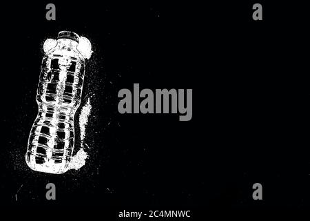 Illustration of a bottle with white splashes on a black background Stock Photo
