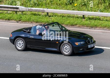 Black BMW Z3 Vehicular traffic moving vehicles, cars driving vehicle on UK roads, motors, motoring on the M6 motorway highway Stock Photo