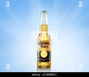 MINSK, BELARUS, june 26, 2020: Chilled bottle of Corona Extra beer bottle of beer on a light blue background in bright rays. Stock Photo