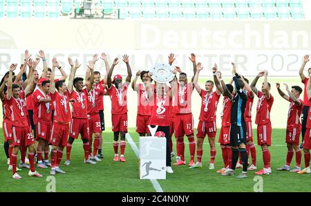 Wolfsburg, Germany, 27 th June 2020,  Winners ceremony after the match: Its the 30 th championship title for FCB.  Trainer Hansi FLICK (FCB), team manager, headcoach, coach,   celebrate with trophy at the 1.Bundesliga match  VFL WOLFSBURG - FC BAYERN MUENCHEN 0-4 in season 2019/2020 am matchday 34. FCB Foto: © Peter Schatz / Alamy Live News / Groothuis/Witters/Pool   - DFL REGULATIONS PROHIBIT ANY USE OF PHOTOGRAPHS as IMAGE SEQUENCES and/or QUASI-VIDEO -   National and international News-Agencies OUT  Editorial Use ONLY Stock Photo