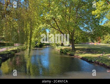 The River Lea flows through the grounds of Hertford Castle, Hertfordshire, England, UK. Stock Photo