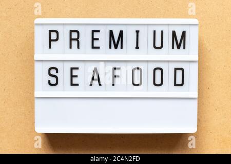 Lightbox with word premium seafood on wood background Stock Photo