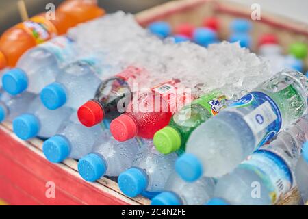 Ice cold bottled water and soft drinks for sale. Stock Photo