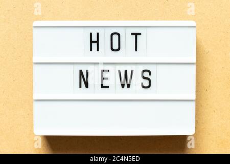 Lightbox with word hot news on wood background Stock Photo