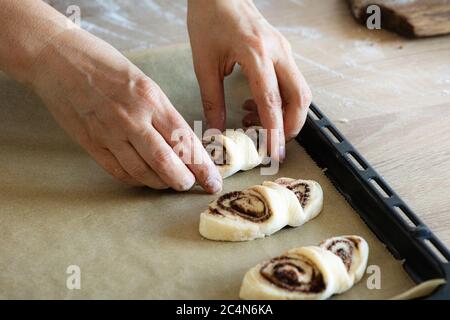 process of making yeast dough sweet rolls Stock Photo