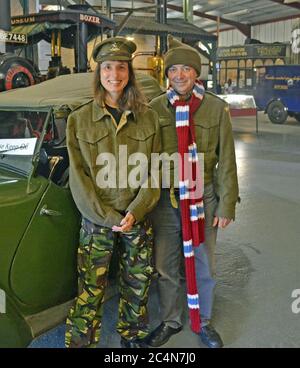 Couple dressed as Captain Mainwaring and Pike from Dad's Army TV series, inside the museum at Bressingham Steam and Gardens, Bressingham, Suffolk, UK Stock Photo