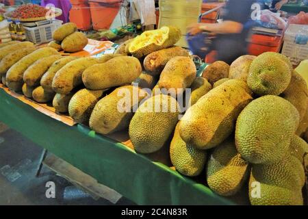 Closeup shot of jackfruit on top of a long table Stock Photo