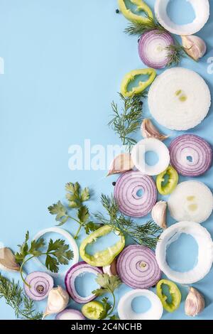 Slices of vegetables in a triangular pattern over a blue background ...