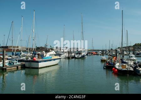 Newhaven Marina view of boats and yachts at moorings on a warm and sunny summers day on the the South Coast of England. Stock Photo